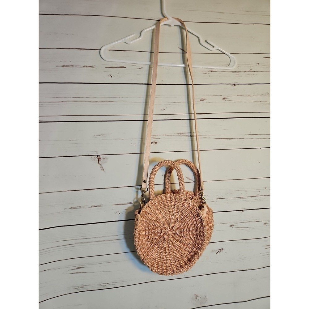 Clare V. Round Straw Woven Crossbody Peach Bag with Leather strap.